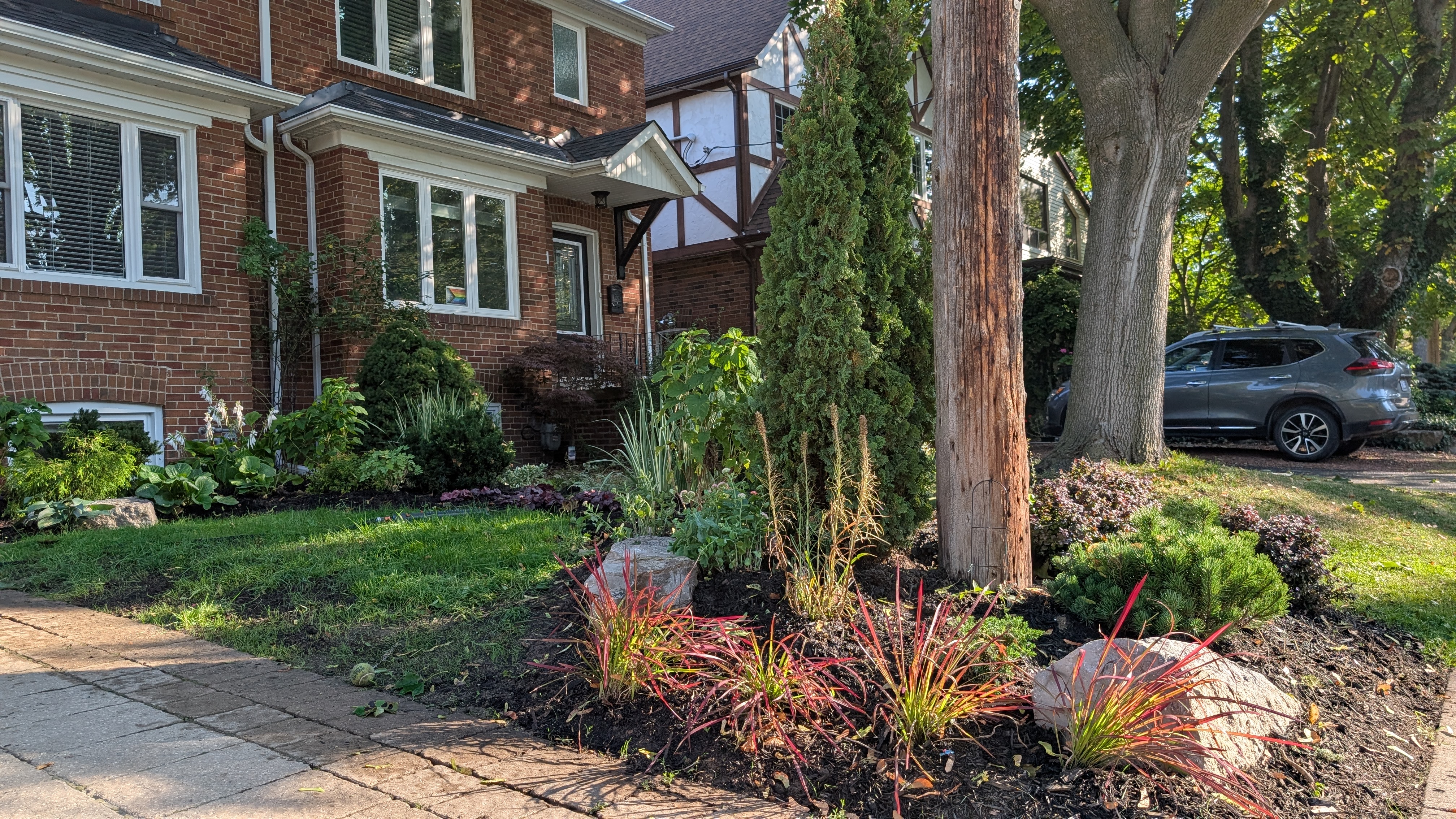 After: lush layered front garden Toronto